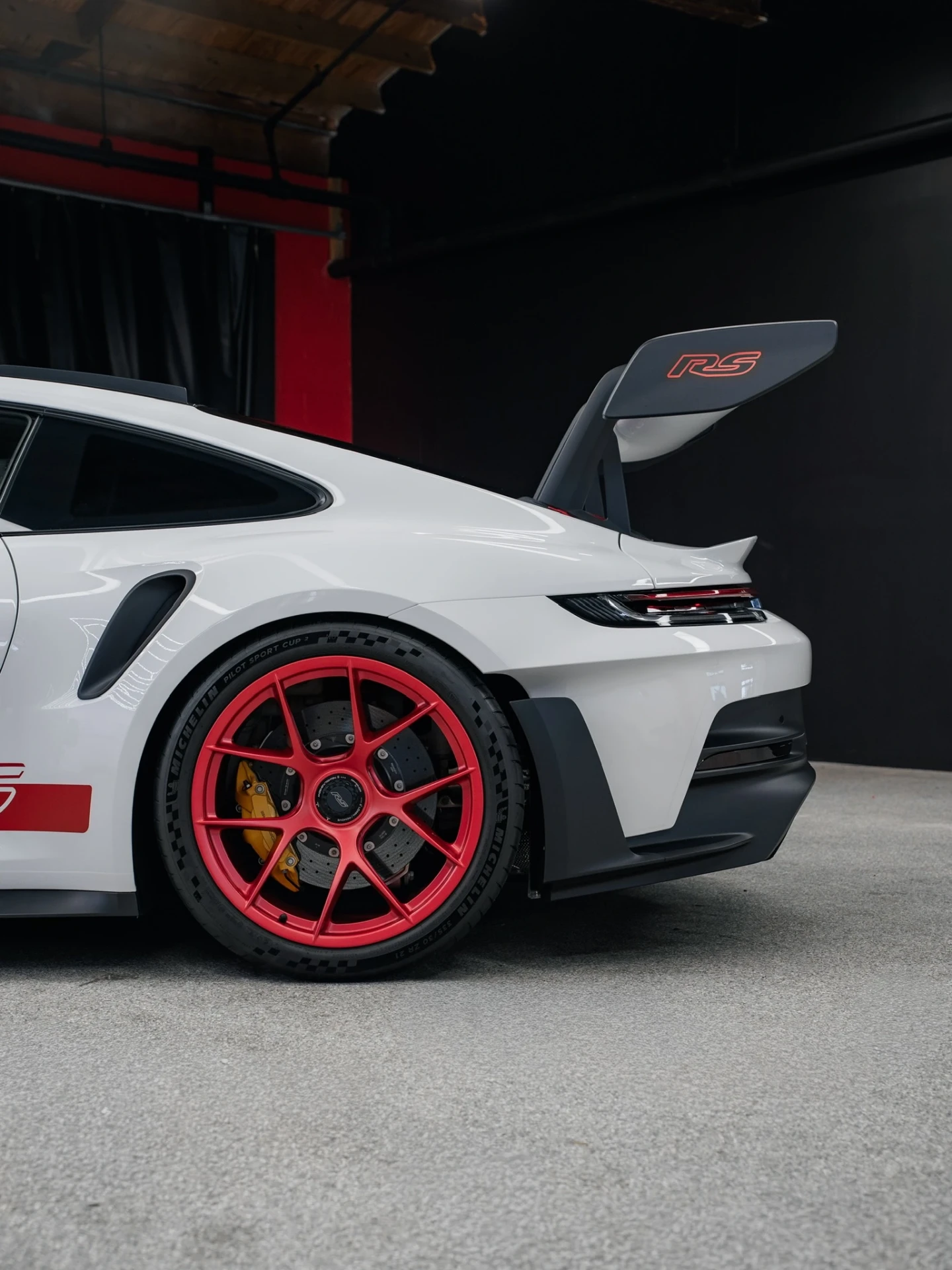 White Porsche 911 GT3 RS with red wheels detailed at Rides Miami
